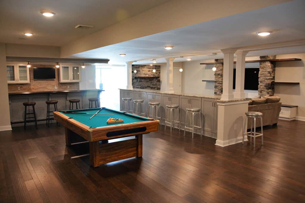 Finished basement with bar, entertainment center and pool table